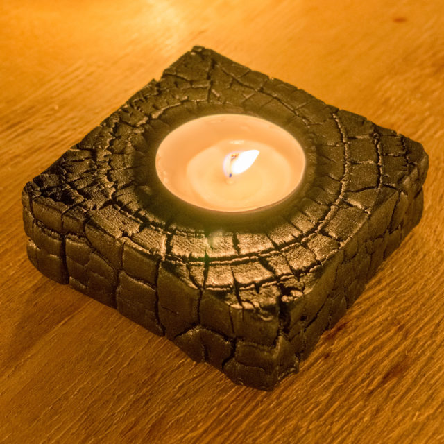 Burnt candle holder